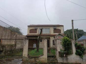 Casa em leilão - Rua Barão de Bagé, 287 - Porto Alegre/RS - Banco Santander Brasil S/A | Z31982LOTE232